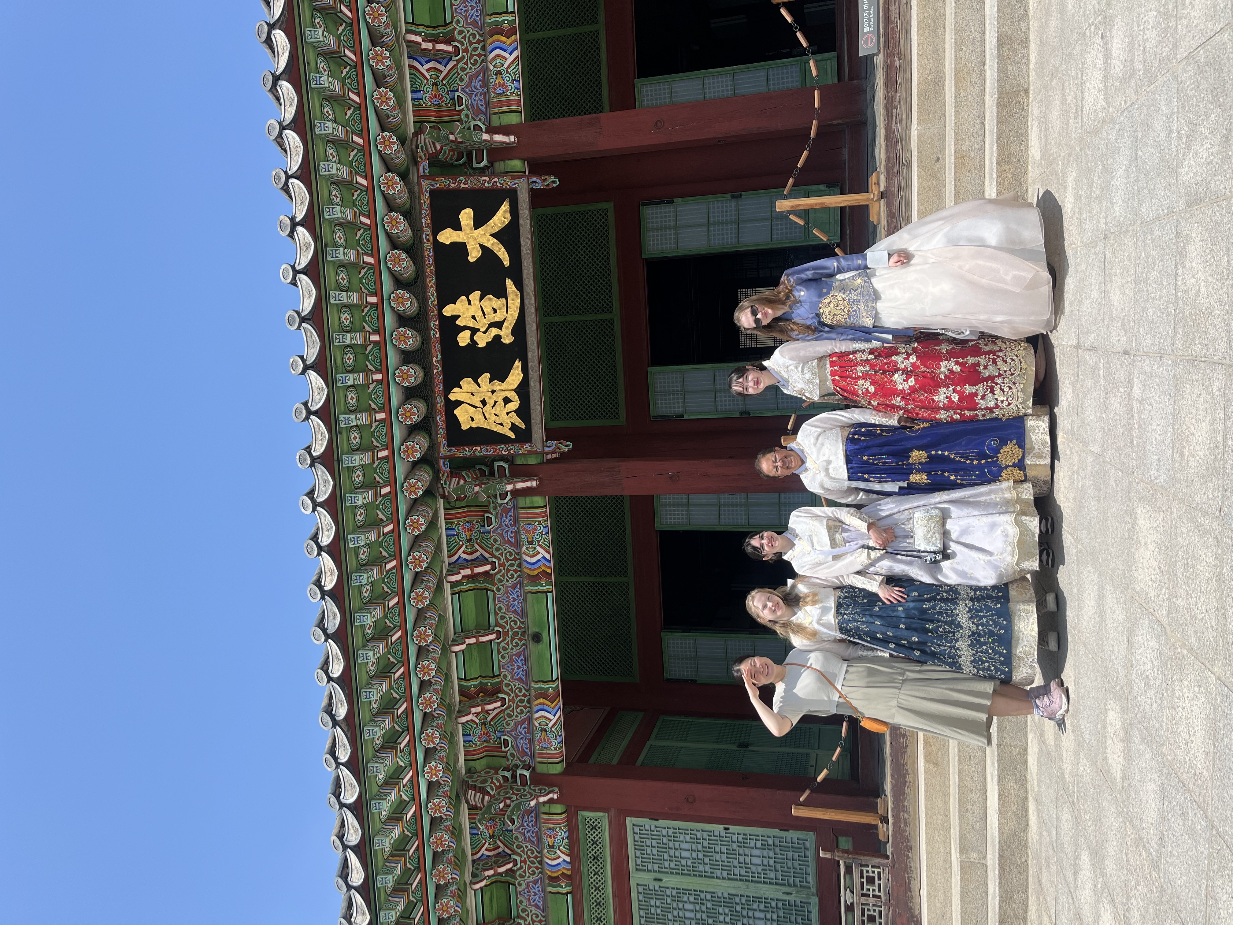 Eunjin and guests wearing traditional hanbok at a Korean palace