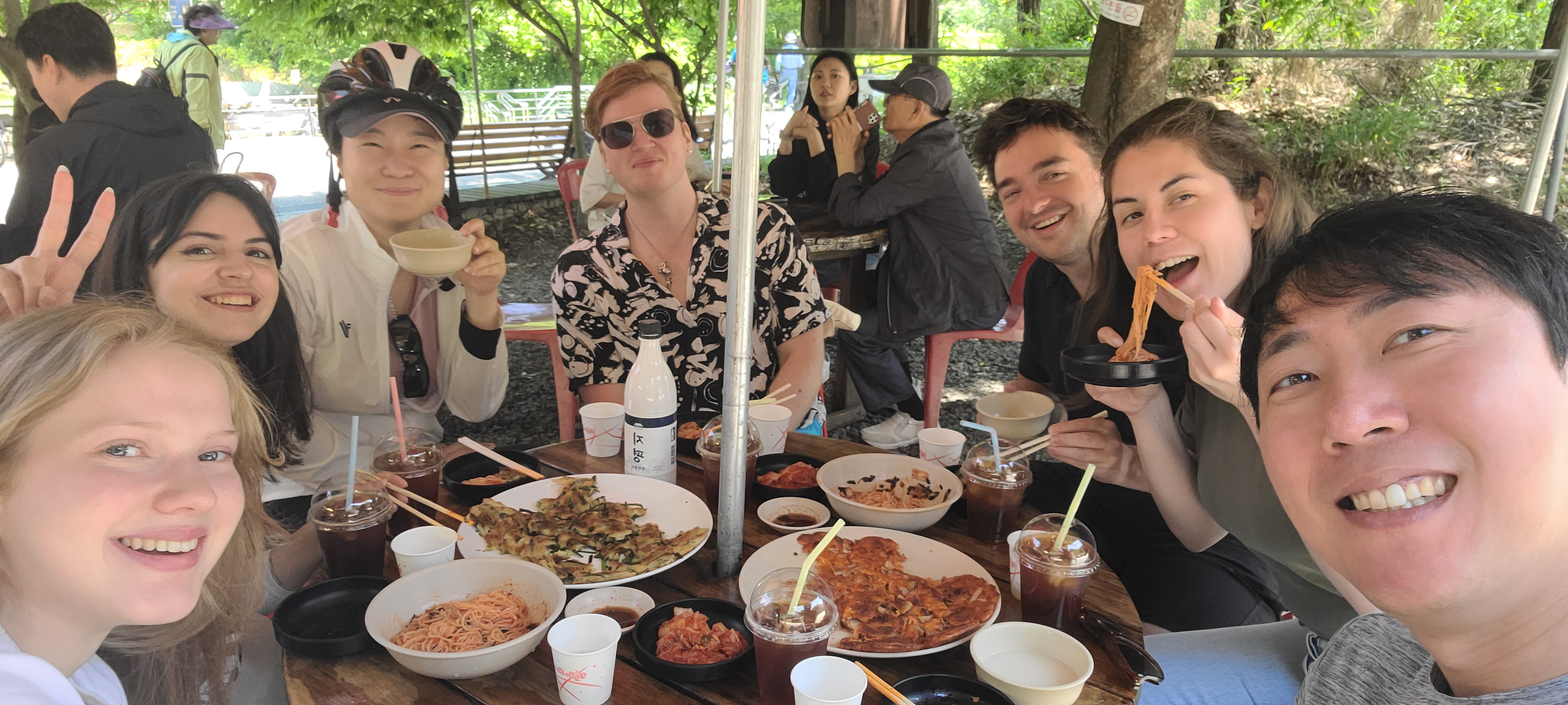 Family in Korea guests sharing a Korean meal together during an outdoor activity