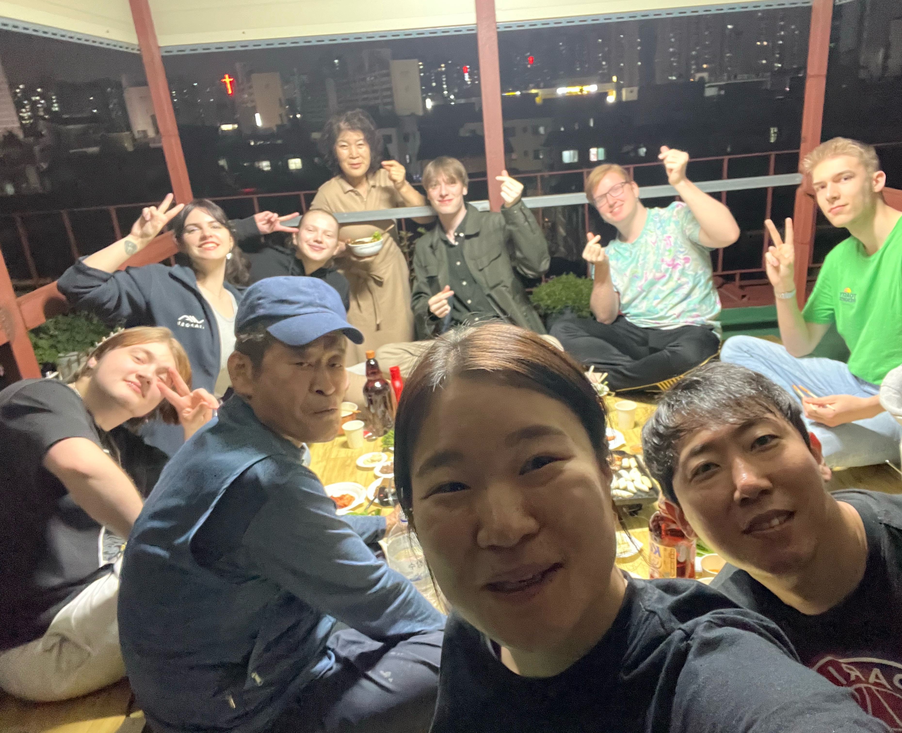 Family dinner on the rooftop with Mom, Dad, and international guests